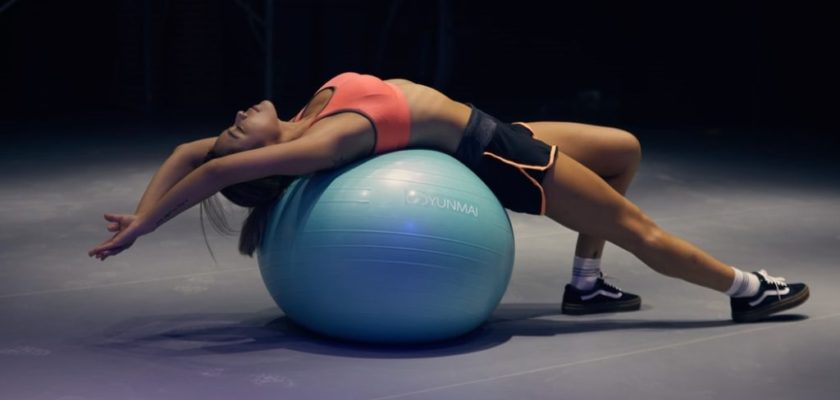 woman working out on fitness ball